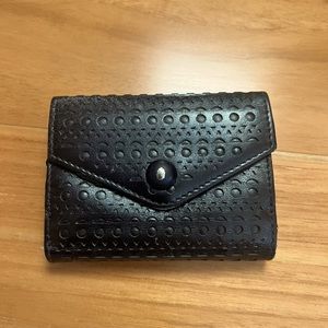 Alaia open work leather flap wallet